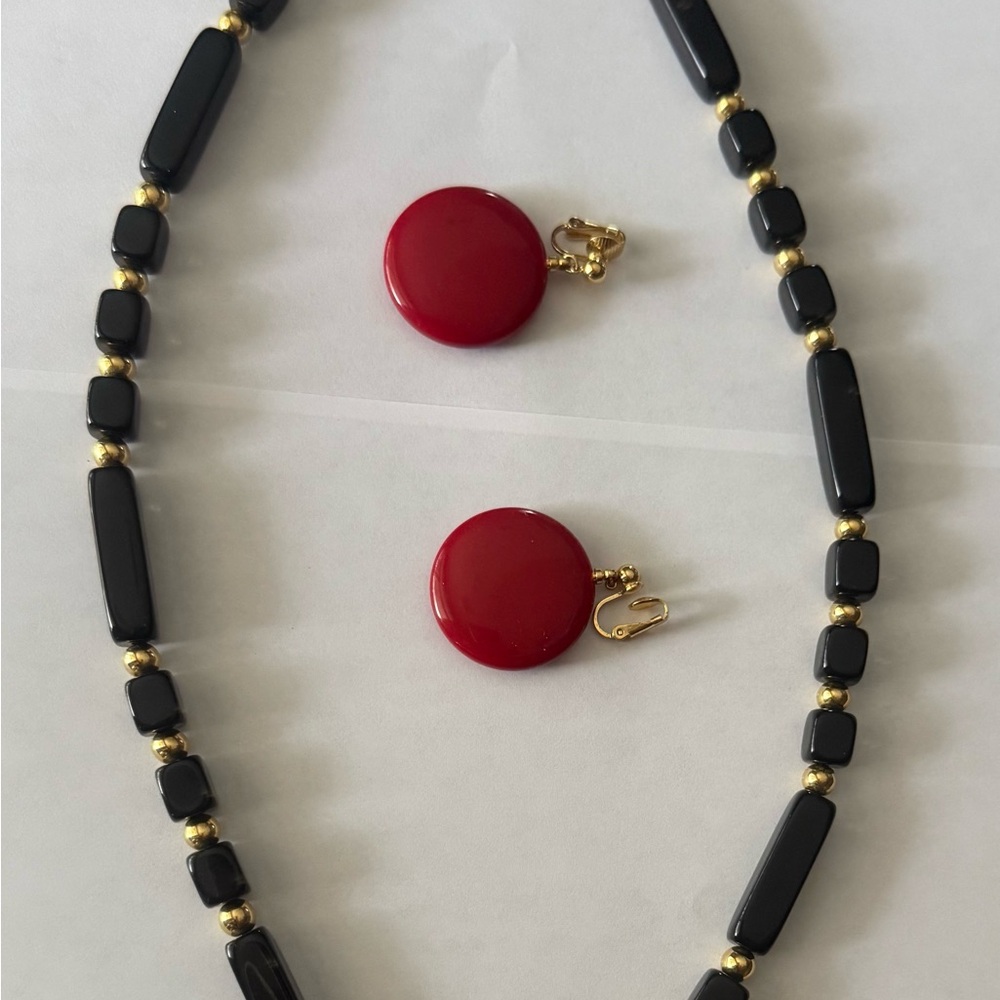 Elegant Stamped Trifari Black and Gold Necklace Set with Red Earrings